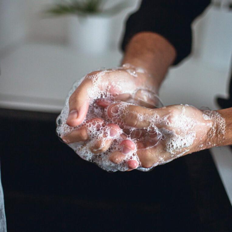 A patient washing their hands